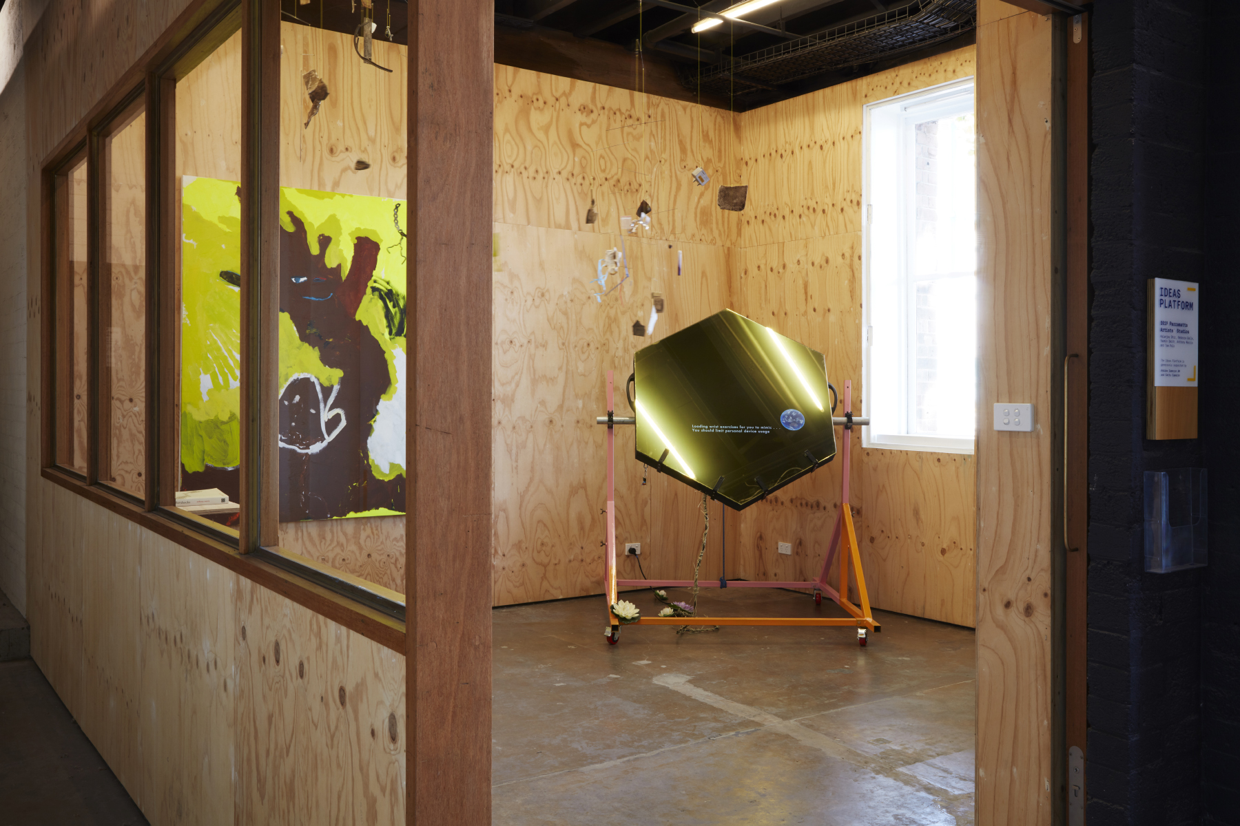 A large hexagonal sculpture in a wood panelled room