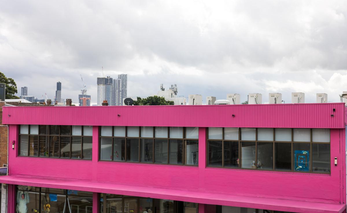 A large building framed against a city skyline