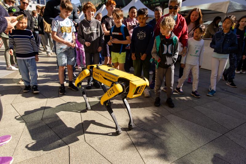 Boys and Girls watching a robot