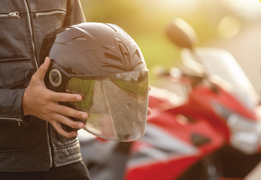 Man holding motorcycle helmet 